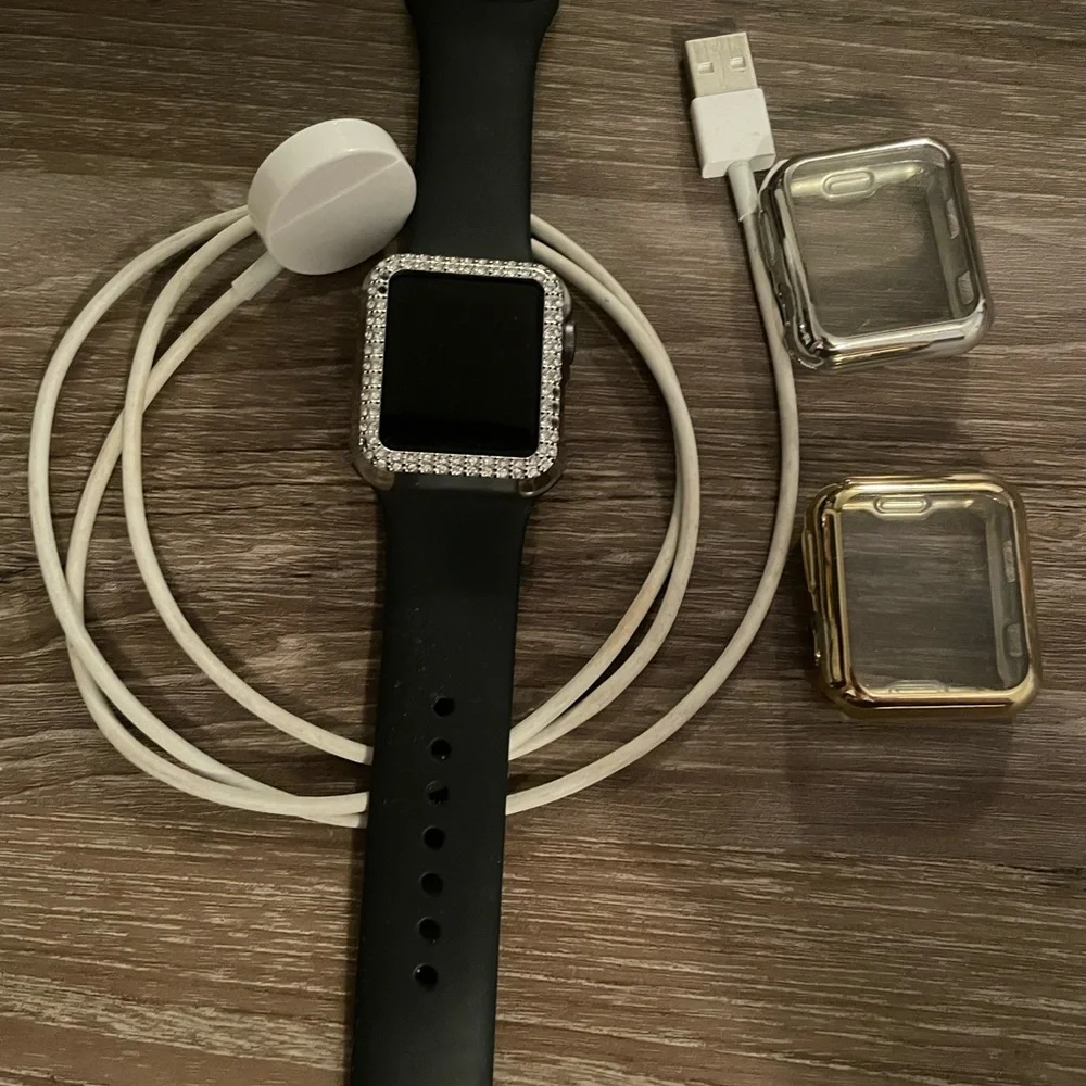 Black Smartwatch with Gold and Silver Cases